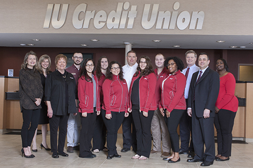 IUCU employees standing in a branch lobby