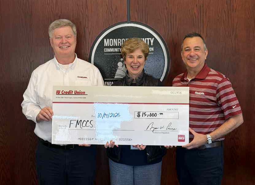 Photo of IUCU employees presenting a check for $15,000 to FMCCS