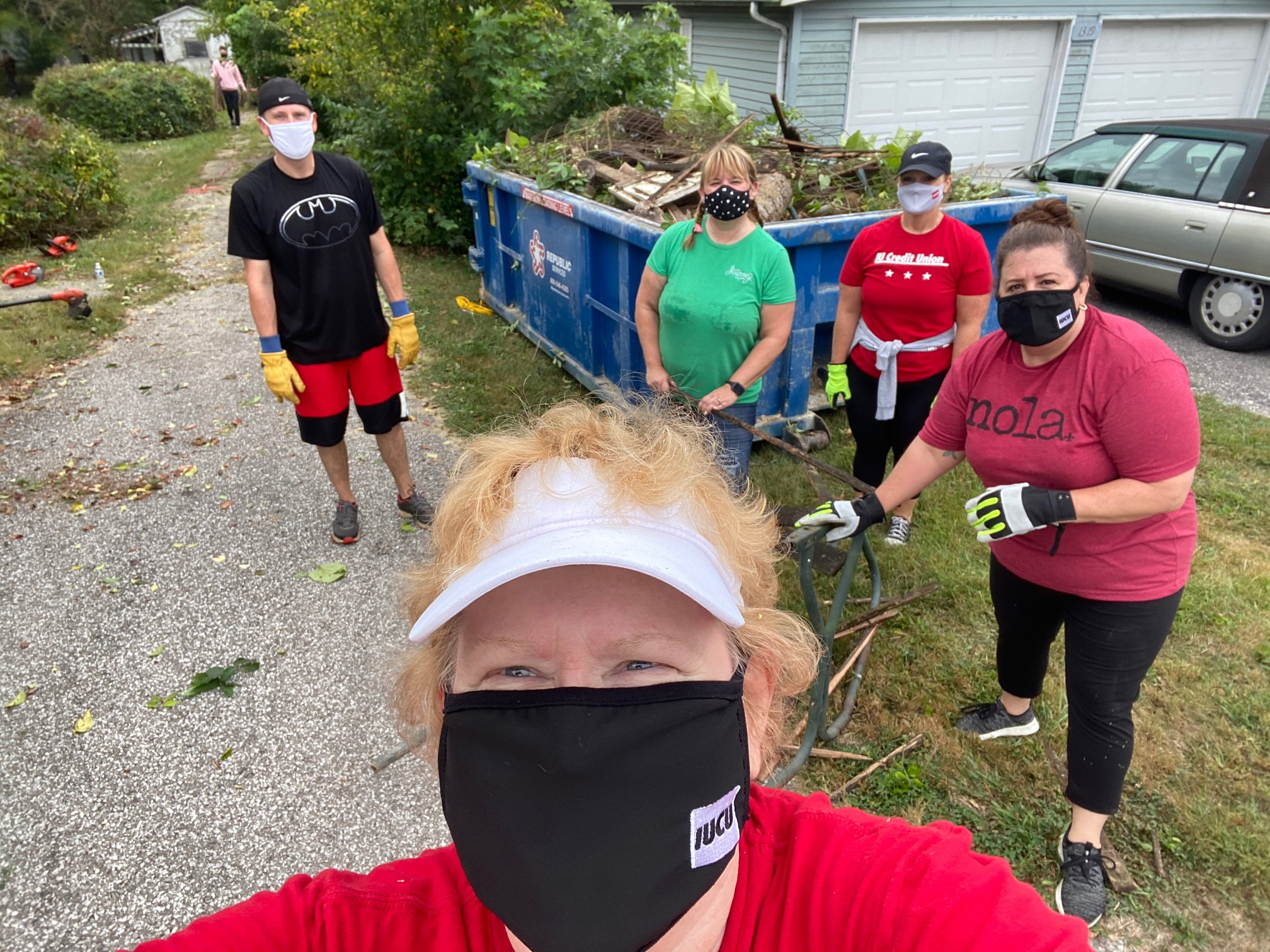 Selfie photo of volunteers cleaning up