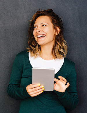 photo of woman using tablet